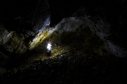man with light in the cave