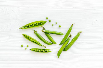 Set of green pea pods on bright background