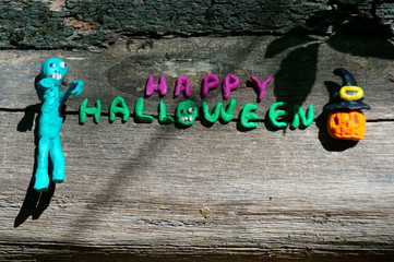 Halloween lettering on a dark background.
