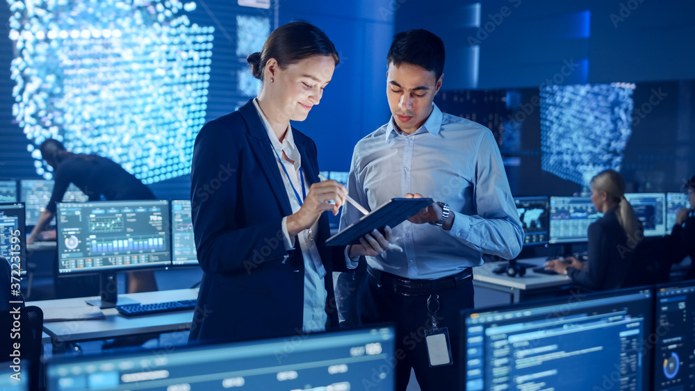 Aufkleber Project Manager and Computer Science Engineer Talking while Using A Digital Tablet Computer. Telecommunications Company System Control and Monitoring Office Room with Working Specialists.