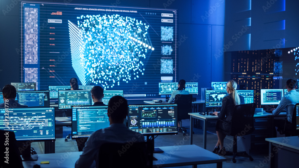 Poster Team of Professional Computer Data Science Engineers Work on Desktops with Screens Showing Charts, Graphs, Infographics, Technical Neural Network Data and Statistics. Dark Control and Monitoring Room.