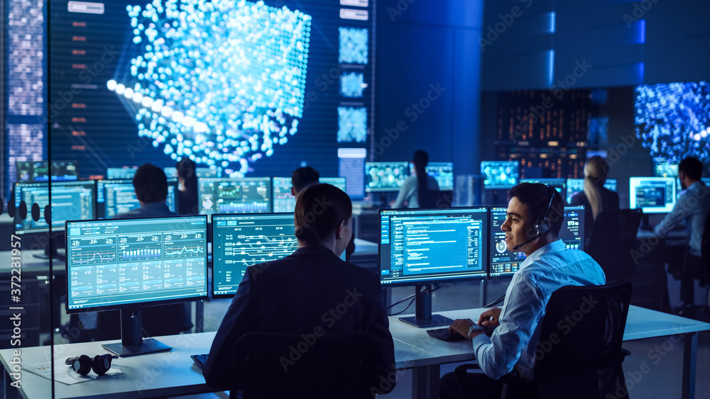 Aufkleber confident female data scientist works closely to her young colleague in big control and monitoring r