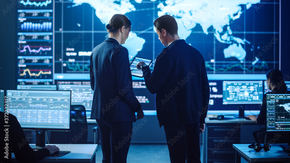 Aufkleber Project Manager and Computer Science Engineer Talking while Using A Digital Tablet Computer. Telecommunications Company System Control and Monitoring Office Room with Working Specialists.