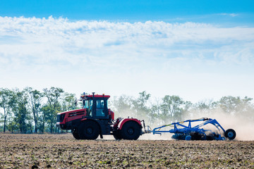 Large tractor working in the field
