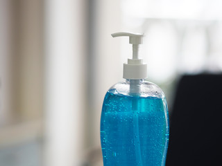 Hand Sanitizer, gel alcoholic mixture with gelatin in clear Plastic bottle with pump pushing wash clean dirty to prevent germs protect Contagious disease corona virus, covid-19