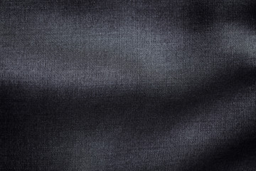 Close up of dark tencel fabric. Tencel (Lyocell) is a form of rayon that consists of cellulose fibre made from dissolving pulp. Top view. Copy space.	