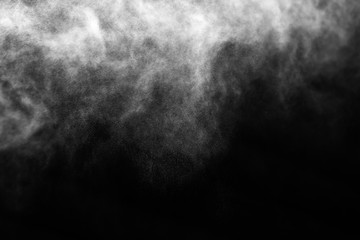 A stream of water and a cloud of drops