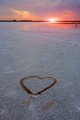 Heart symbol on surface of salt lake