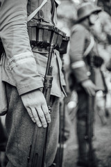 Detail of a rifle held by a soldier. Rifle and uniform from the First World War