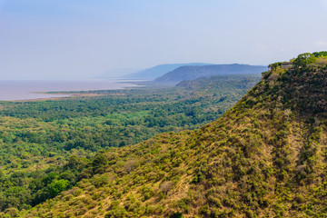Fototapeta na wymiar Panoramic view on Manyara Lake from Viewpoint. Beautiful landscape scenery of Lake Manyara National Park, Tanzania - Travel destination for wildlife Safari in Africa