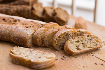 fresh loaf of bread on wooden board