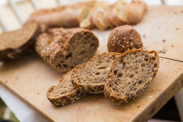 fresh loaf of bread on wooden board