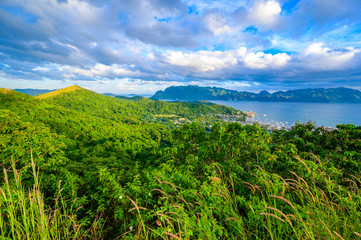 View of Coron Town and Bay from Mount Tapyas on Busuanga Island at sunset - tropical destination with paradise landscape scenery, Palawan, Philippines.