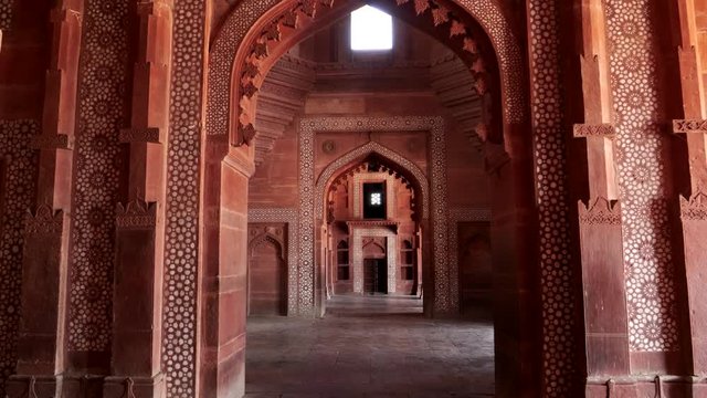 a gimbal stabilized clip walking west in buland darwaza gate at fatehpur sikri near agra, india