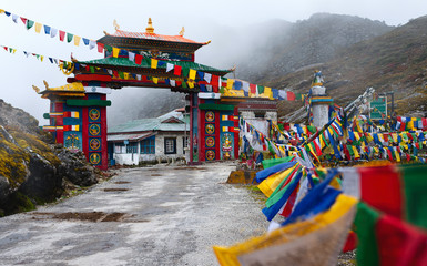 Colorful gateway with Buddhist prayer flags in Himalayas. Tawang, India. © Daniel
