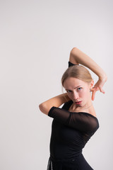 The concept of rhythmic gymnastics. Portrait of caucasian model at full height with fair hair