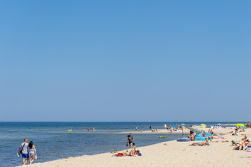 Fototapeta na wymiar people enjoy a day on the beach in Wolinski National Park on the Baltic Sea