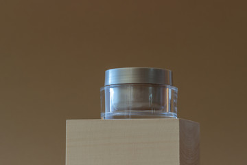 A jar of cream on a beige background. Cosmetics. Skincare. Mock-up. Copy space.
