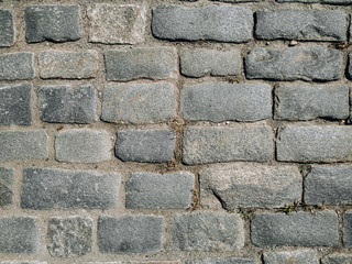 Texture of gray paving stones, top view.