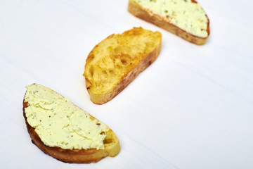 Ciabatta with cream cheese on white background. Toasted sandwich toast.