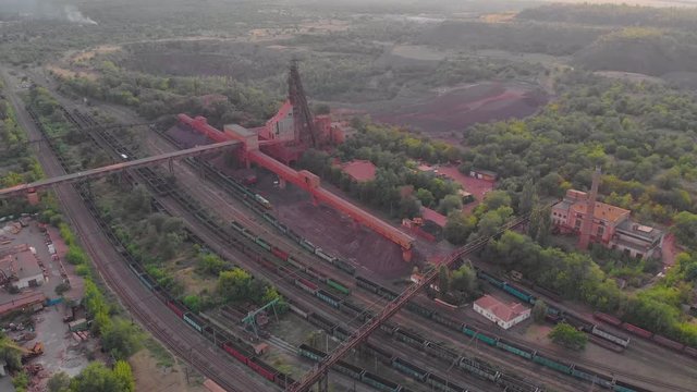 Iron ore mining red iron ore headframe aerial drone right movement left panorama camera movement Krivoy Rog Ukraine