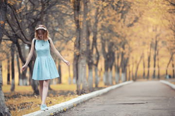 Young girl on a walk in the autumn