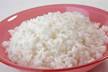 groats in plate on white