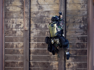 Special forces soldiers storm the walls