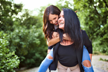 Two happy beautiful girls having fun outdoor