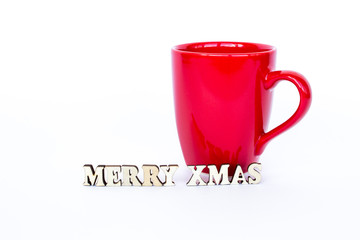 Red cup with the inscription Merry Christmas isolated on a white background. Template for a Christmas card. Copy space.
