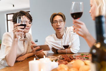 Cheerful happy friends having party via video call