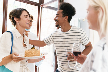 Happy friends celebrating a surprise birthday