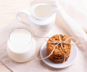 Fototapeta na wymiar homemade oatmeal cookies on rustic background