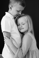 Fototapeta na wymiar Little boy and little girl. Brother and sister. High quality photo.