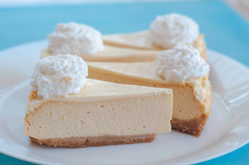 cheesecake pattern, servings of cheesecake on a blue background top view