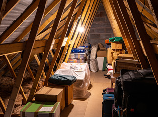 Loftspace in the attic roof of a family home, is a favourite storage place for cases, boxes and...