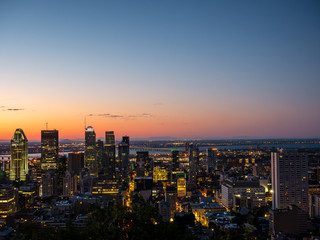 Montreal sunrise viewed from Mount Royal with city skyline in the morning
