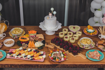 First Anniversary Party. Balloons, food and cake for children's birthday. The first birthday of the baby. Modern Vintage Decor for children's birthday. Birthday party concept.