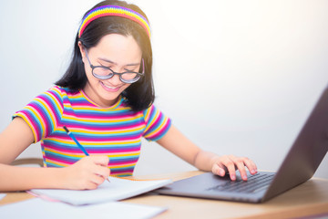 Distance learning online education,Smiling girl student study online with skype teacher, happy...