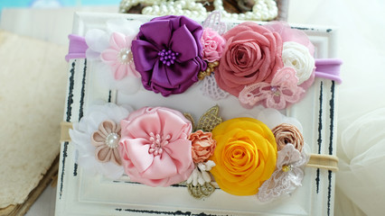 A bouquet of flowers made out of fabric cloth textile in beautiful pastel colors that can be used as hair accessory, decoration, and embellishment