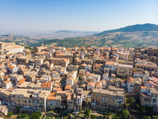 Fototapeta na wymiar Tricarico town, province of Matera, Basilicata, southern Italy. It is home to one of the best preserved medieval historical centres in Italy. aerial view of tricarico with its Norman tower