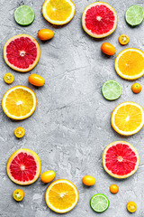 Fototapeta na wymiar sliced citrus on stone table background top view mock up
