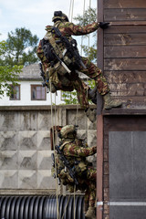 Special forces soldiers storm the walls