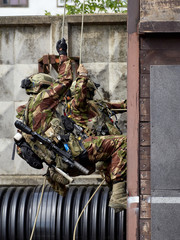 Special forces soldiers storm the walls