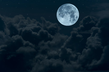 Naklejka na ściany i meble Full moon with blurred dark clouds in the night.