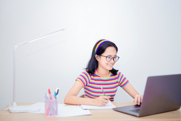 Distance learning online education,Smiling girl student study online with skype teacher, happy...