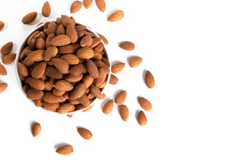 Top view, almonds in white bowl on white background with space for your text.