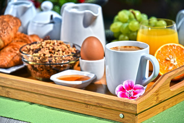 Breakfast served with coffee, juice, croissants and fruits