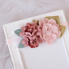 A bouquet of flowers made out of fabric cloth textile in beautiful pastel pink theme colors that can be used as hair accessory, decoration, and embellishment