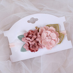 A bouquet of flowers made out of fabric cloth textile in beautiful pastel pink theme colors that can be used as hair accessory, decoration, and embellishment